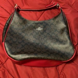 Brown and red Coach signature leather bag